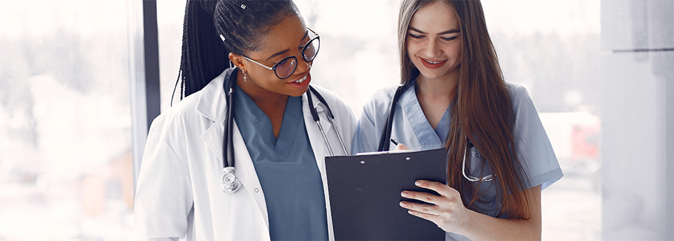 healthcare employees reviewing patient chart